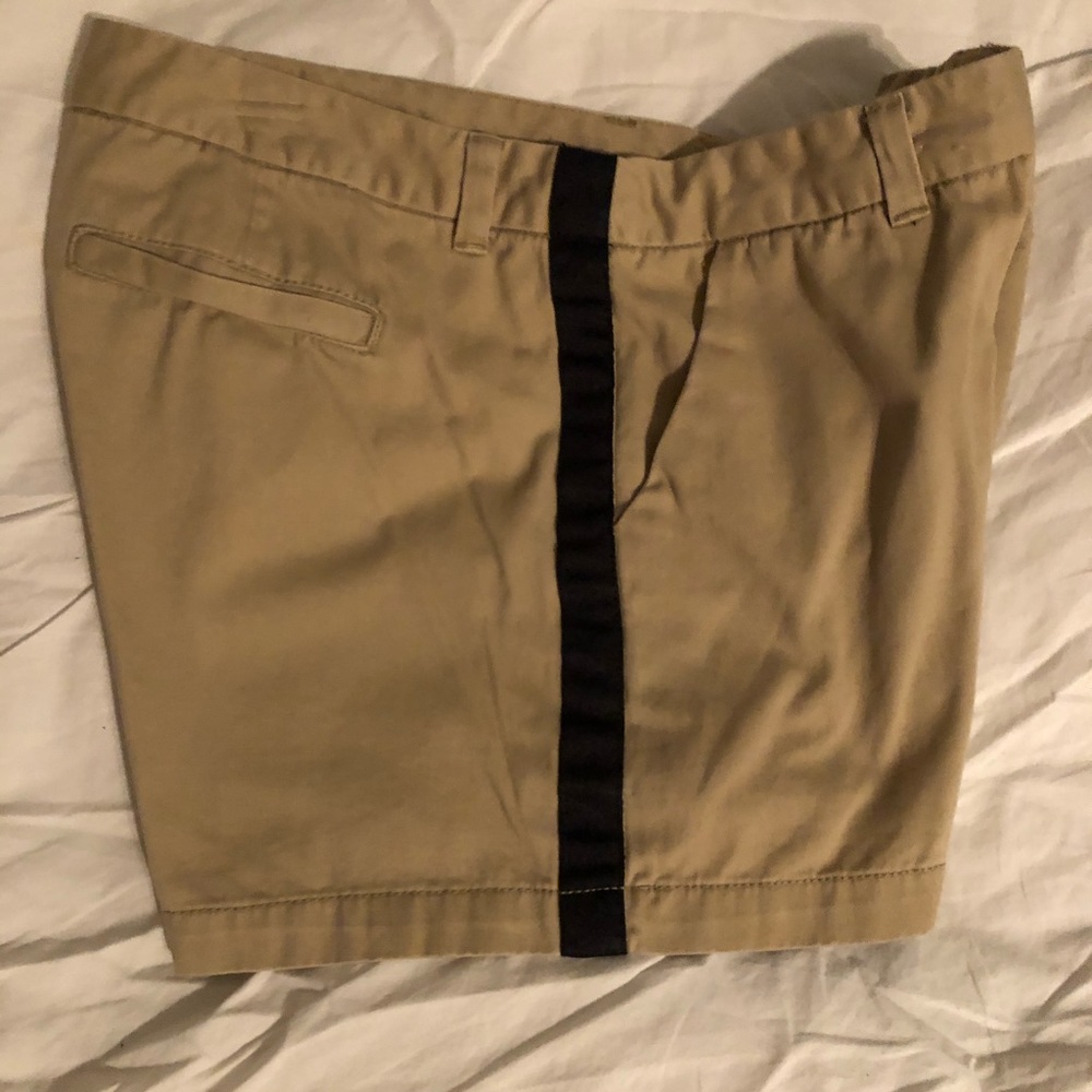 Khaki shorts with Black stripes on side. Size 12